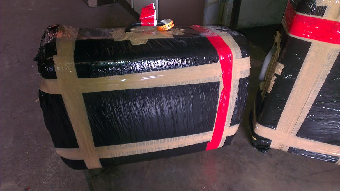 suitcase shipping cost